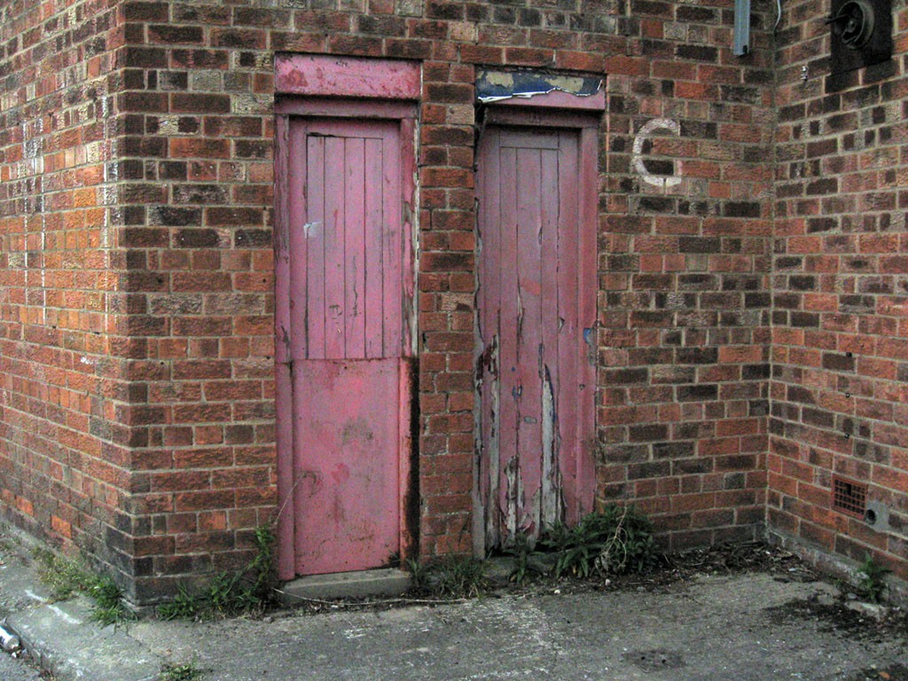 Faded and shabby painted turnstile gates