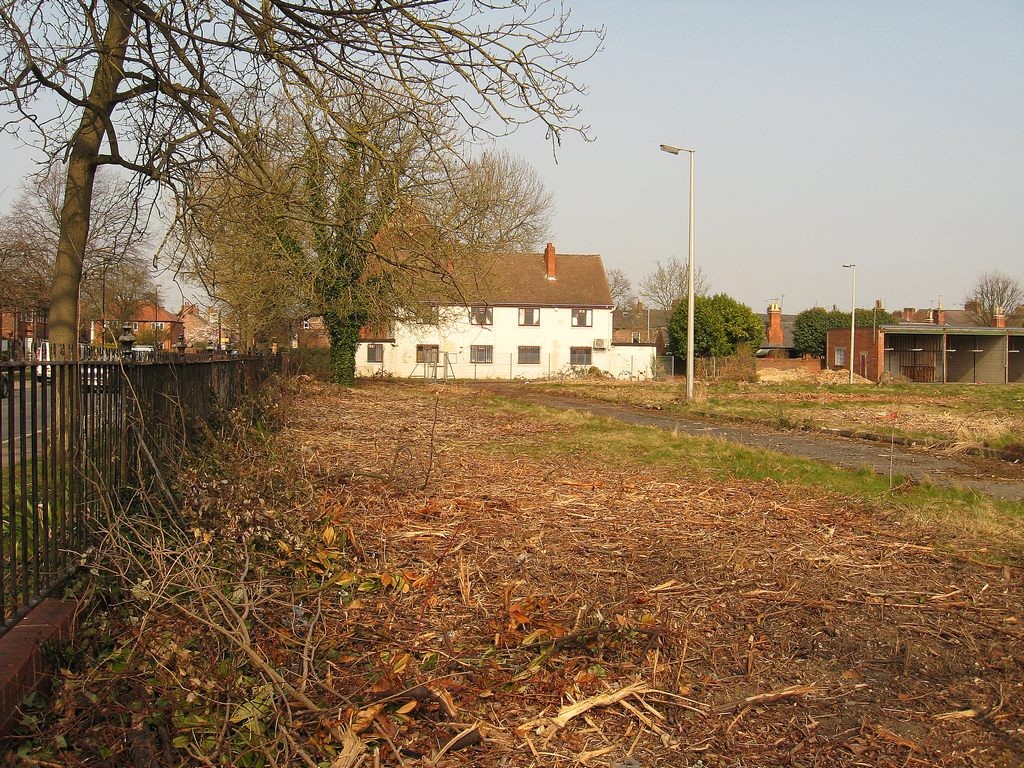 Across the front part of the site, from Burton Stone Lane