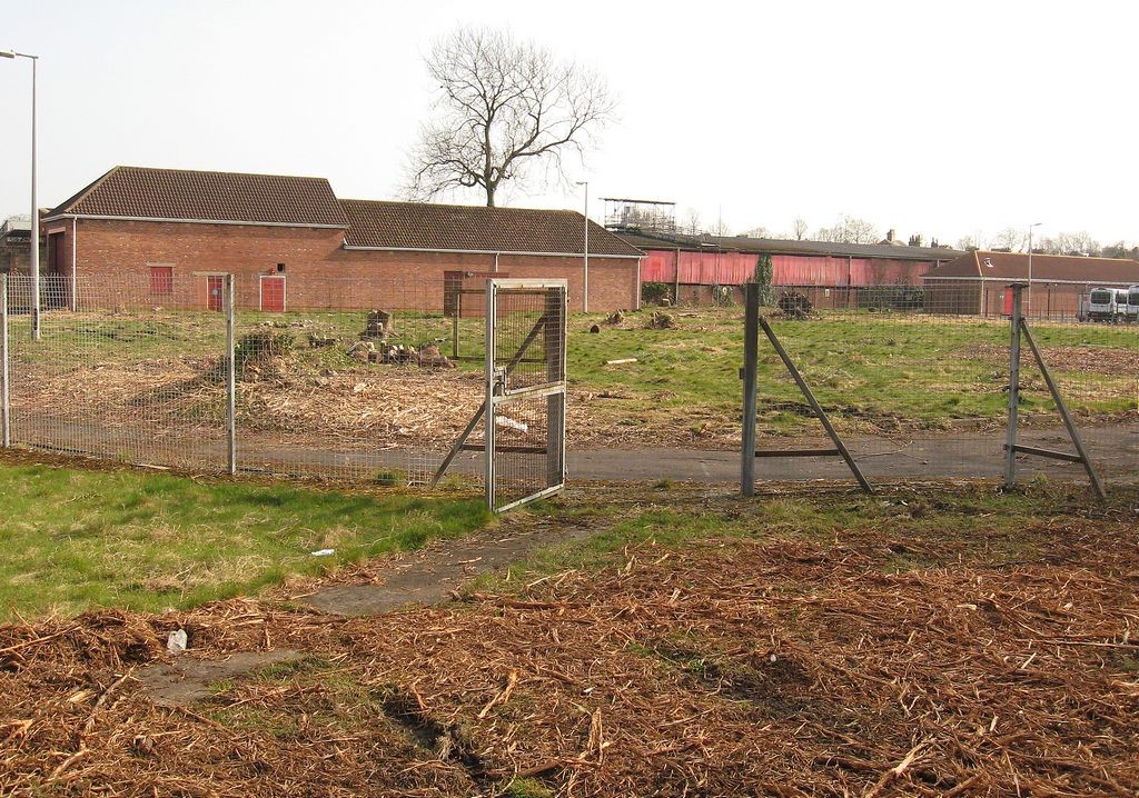 Grass, paths, fencing and buildings, signs of vegetation clearance