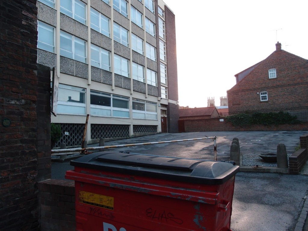 1960s office building. Bin in foreground