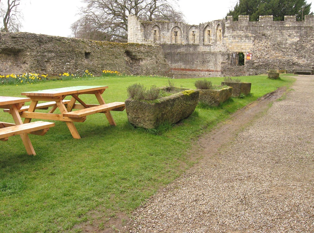 Grassed area with benches, Roman wall in background