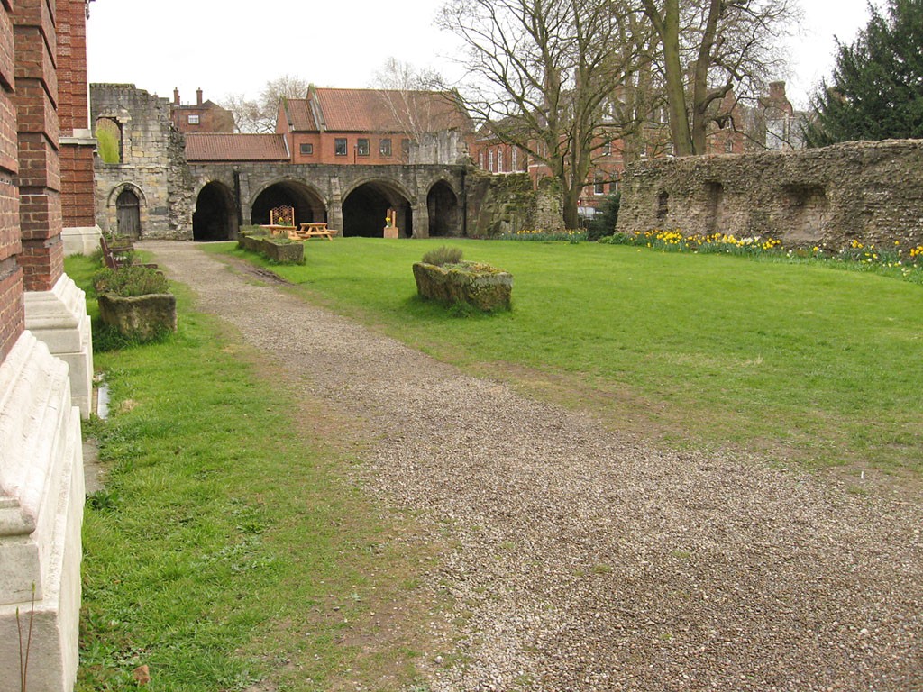 Grassed area with medieval ruin in background