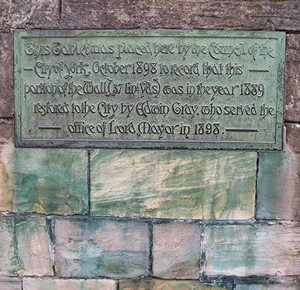 Plaque recording 19th century restoration work on city walls