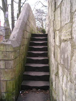 Well-worn steps, city walls by Bootham Bar