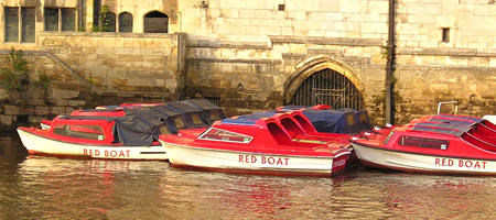 Guildhall buildings and red boats
